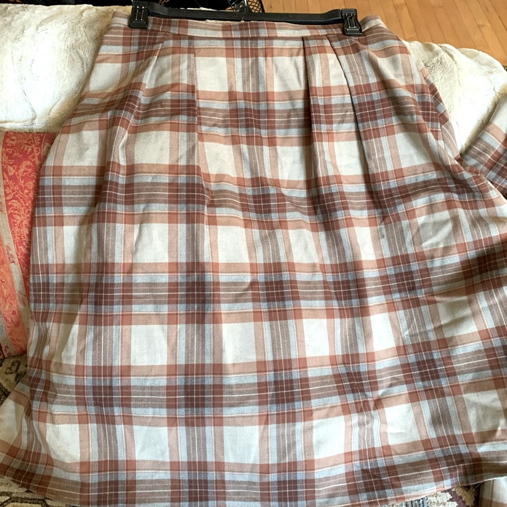 Cremiux suit jacket and knee length skirt.  New with tags.  Never worn, size 14.